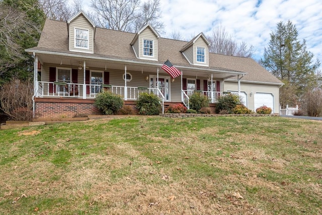 cape cod house with covered porch, an attached garage, a shingled roof, and a front yard