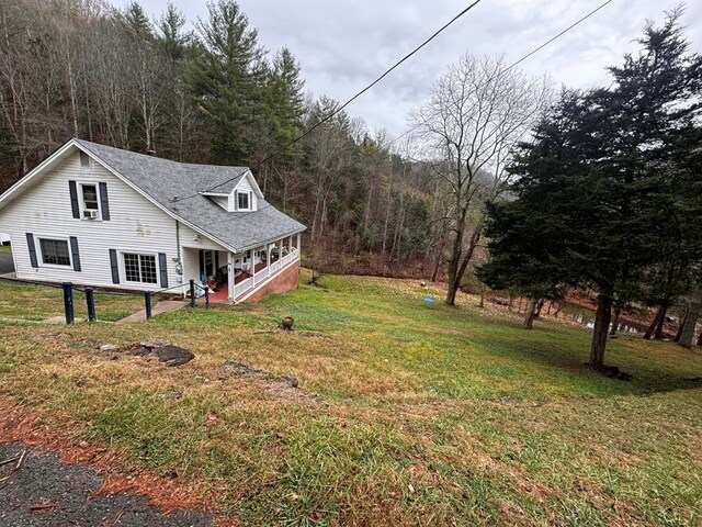 196 Goodwin Rd, Cedar Bluff, VA 24609 - view of grassy yard with covered porch and a view of trees