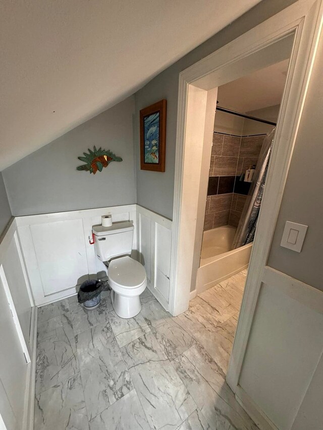 196 Goodwin Rd, Cedar Bluff, VA 24609 - full bath featuring marble look tile flooring, toilet, shower / tub combo with curtain, and wainscoting