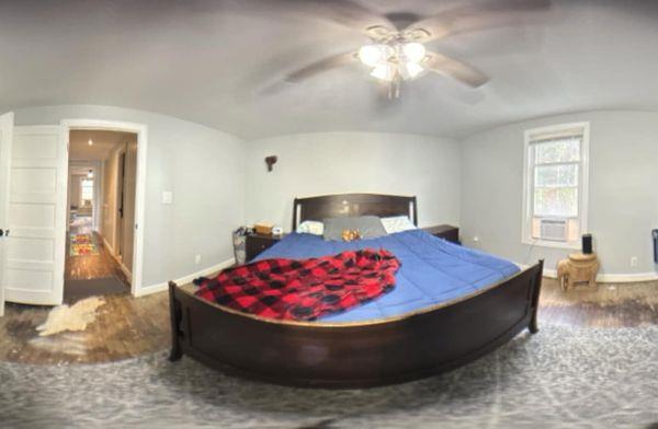 196 Goodwin Rd, Cedar Bluff, VA 24609 - bedroom featuring baseboards, wood finished floors, lofted ceiling, and ceiling fan
