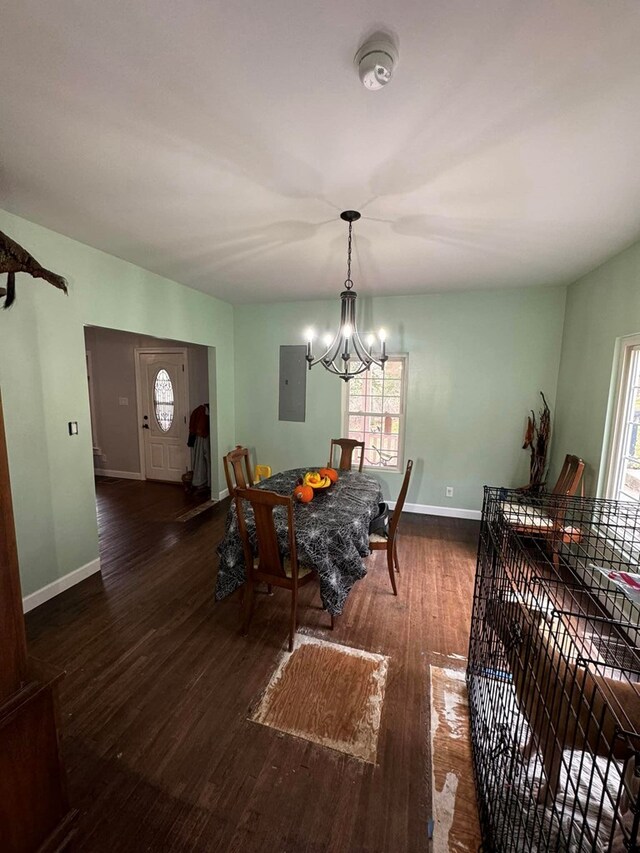 196 Goodwin Rd, Cedar Bluff, VA 24609 - dining area with a chandelier, healthy amount of natural light, wood finished floors, and baseboards