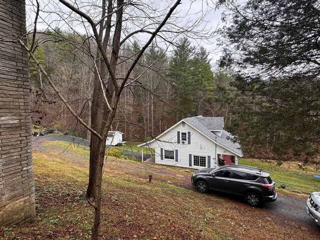 196 Goodwin Rd, Cedar Bluff, VA 24609 - view of property exterior with a view of trees and a shingled roof