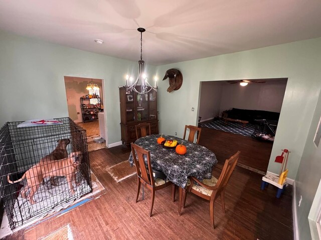 196 Goodwin Rd, Cedar Bluff, VA 24609 - dining room featuring a chandelier, wood finished floors, and baseboards