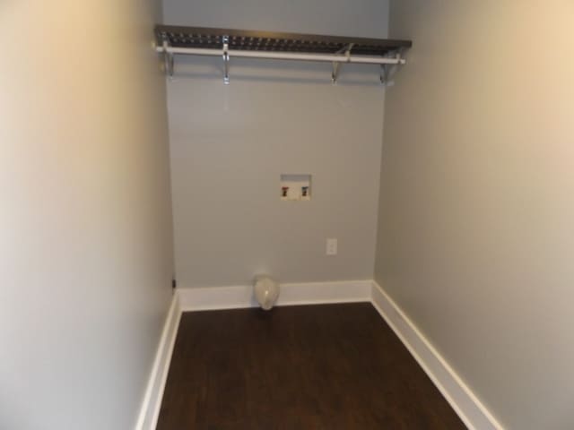 laundry room featuring dark hardwood / wood-style floors and washer hookup