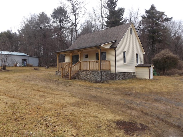 view of front of property with a porch and a front yard