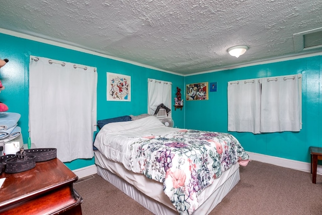 bedroom with carpet floors, baseboards, attic access, and a textured ceiling