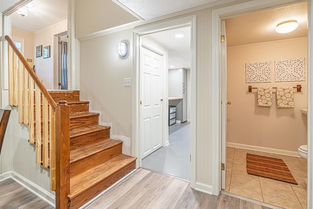 503 Court St, Abingdon, VA 24210 - staircase featuring crown molding and wood finished floors