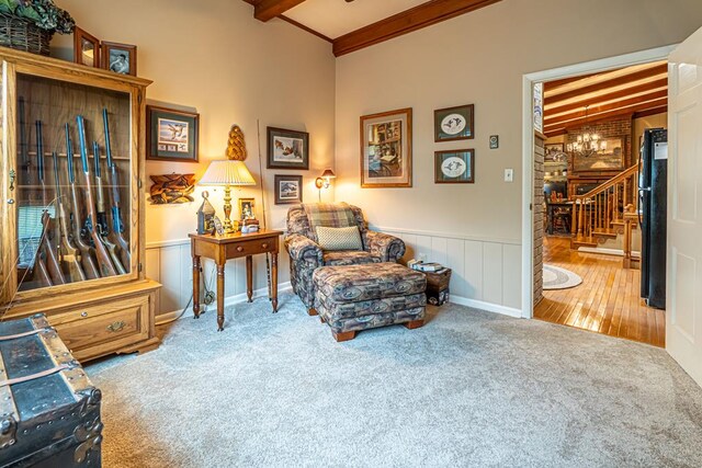 503 Court St, Abingdon, VA 24210 - living area featuring carpet floors, stairway, wainscoting, and a chandelier