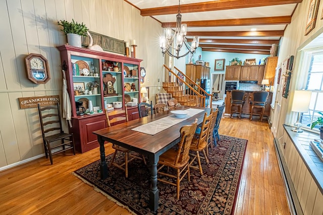 503 Court St, Abingdon, VA 24210 - dining area with light wood-type flooring, a chandelier, beam ceiling, a baseboard radiator, and stairway