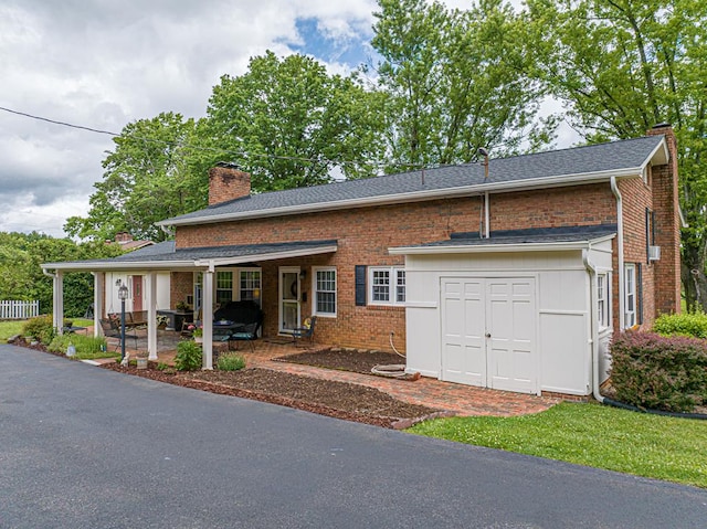 503 Court St, Abingdon, VA 24210 - view of front of property featuring a chimney, brick siding, and a patio