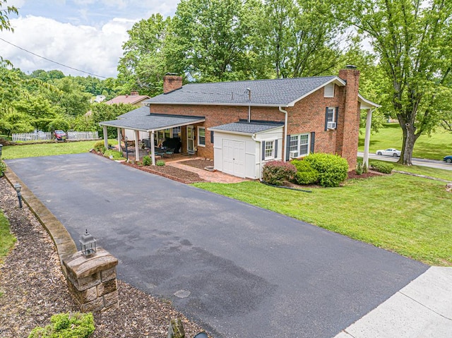 503 Court St, Abingdon, VA 24210 - view of front facade featuring a chimney, brick siding, and asphalt driveway