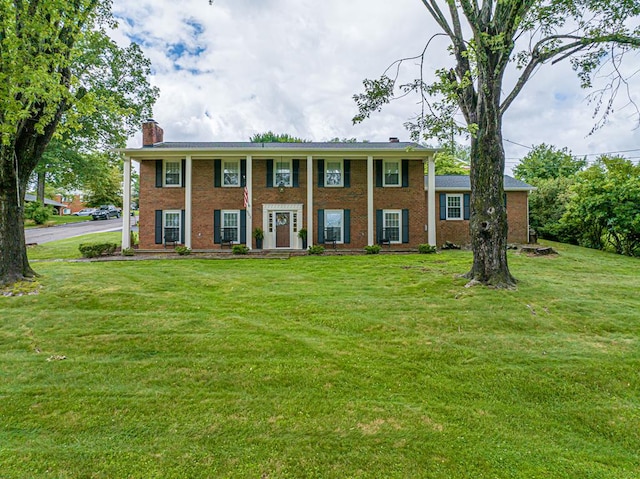 503 Court St, Abingdon, VA 24210 - neoclassical home featuring a chimney, a front yard, and brick siding