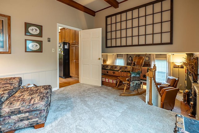 503 Court St, Abingdon, VA 24210 - living area with carpet flooring, beamed ceiling, a wainscoted wall, and high vaulted ceiling