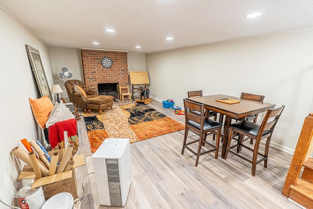 503 Court St, Abingdon, VA 24210 - dining area featuring light wood-type flooring, a fireplace, and recessed lighting
