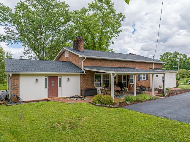 503 Court St, Abingdon, VA 24210 - view of front of house with a chimney, a front yard, brick siding, and a patio