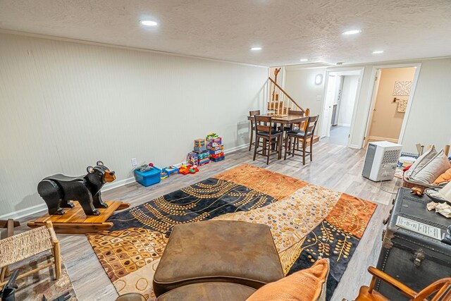 503 Court St, Abingdon, VA 24210 - living area featuring stairway, wood finished floors, a textured ceiling, and recessed lighting