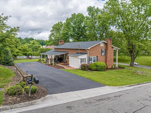 503 Court St, Abingdon, VA 24210 - view of front of property with a chimney, a front yard, driveway, and brick siding