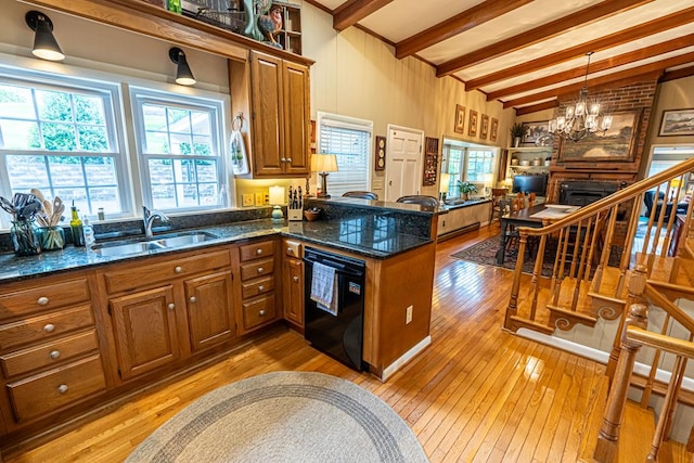 503 Court St, Abingdon, VA 24210 - kitchen featuring dishwasher, brown cabinetry, light wood-style flooring, and a chandelier