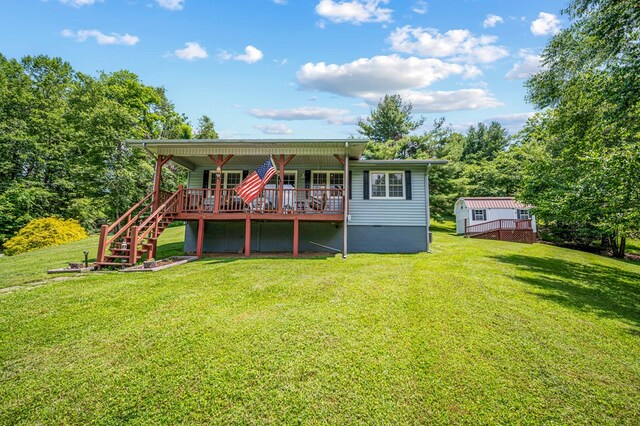 575 Apache Trl, Fancy Gap, VA 24328 - back of property featuring a deck and a lawn