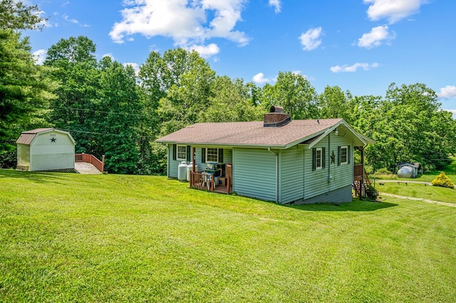 575 Apache Trl, Fancy Gap, VA 24328 - view of side of home featuring a storage shed, crawl space, a chimney, and a yard