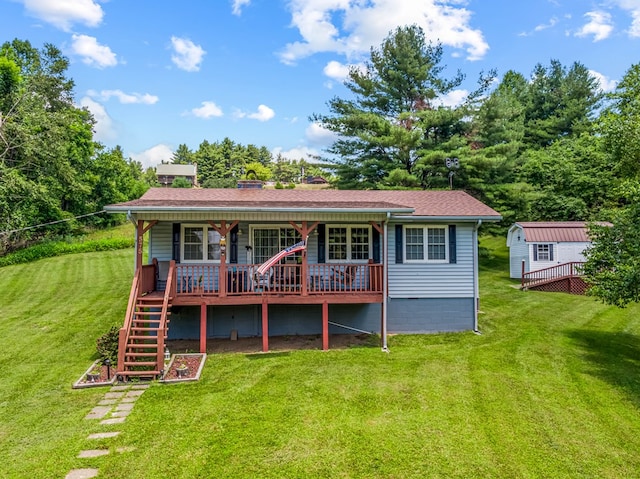 575 Apache Trl, Fancy Gap, VA 24328 - back of house featuring a lawn, a deck, stairs, and an outbuilding