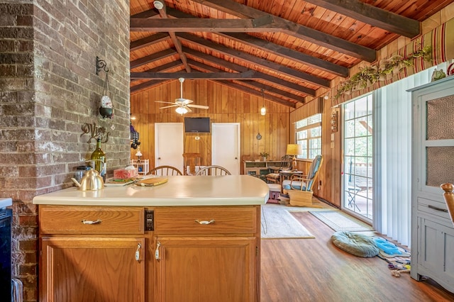 575 Apache Trl, Fancy Gap, VA 24328 - kitchen with light wood finished floors, wood ceiling, light countertops, a peninsula, and wood walls