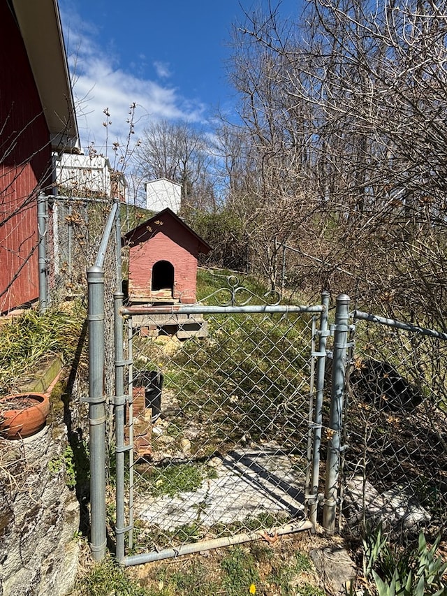 view of gate featuring fence