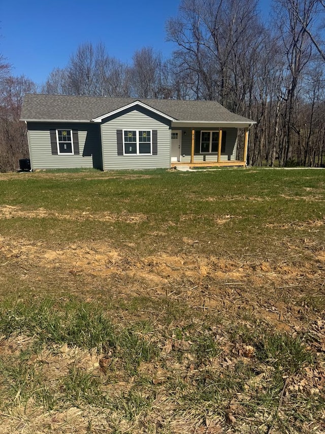 view of front of property with a porch and a front lawn