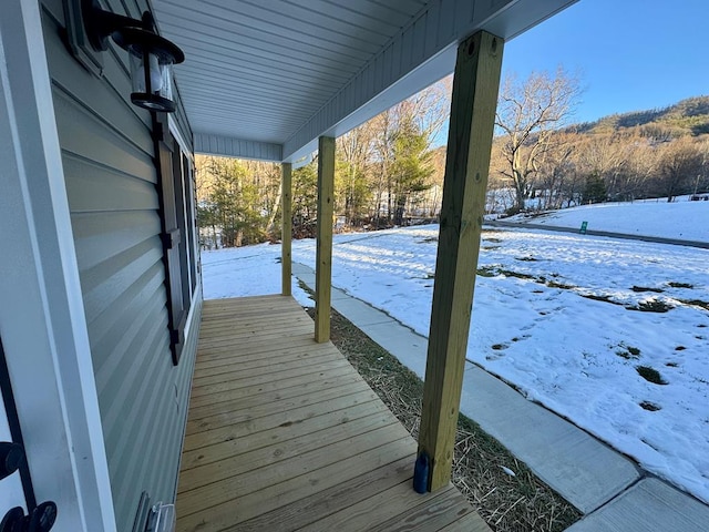 view of snow covered deck
