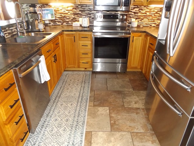 566 Breezy Ridge Rd, Woodlawn, VA 24381 - kitchen featuring appliances with stainless steel finishes, tasteful backsplash, dark countertops, and stone finish floors