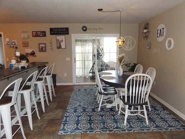 566 Breezy Ridge Rd, Woodlawn, VA 24381 - dining space featuring baseboards and stone finish flooring