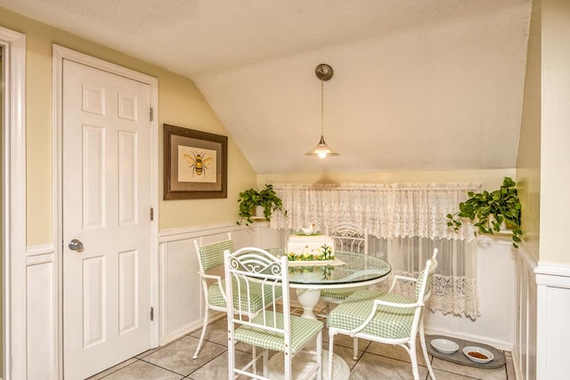18357 Westwood Dr, Abingdon, VA 24211 - dining room with vaulted ceiling, light tile patterned flooring, and a textured ceiling