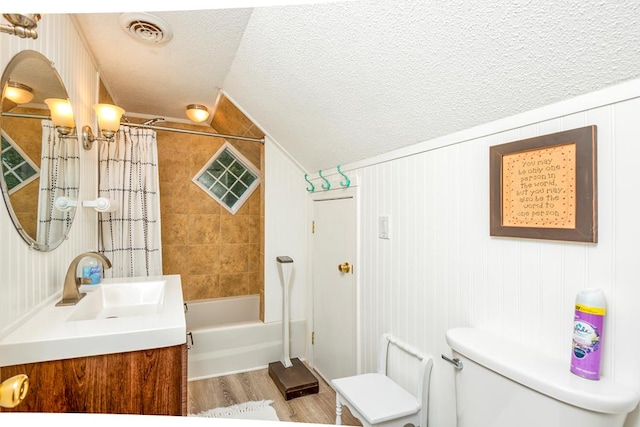18357 Westwood Dr, Abingdon, VA 24211 - full bath with vanity, a textured ceiling, wood finished floors, shower / tub combo, and lofted ceiling