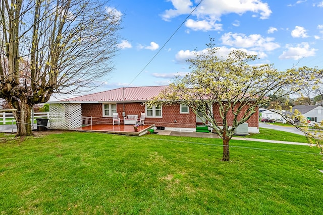480 N 3rd St, Wytheville, VA 24382 - back of house featuring a deck, brick siding, central AC unit, and metal roof