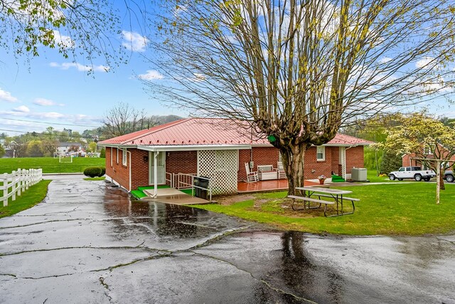 480 N 3rd St, Wytheville, VA 24382 - view of home's exterior with brick siding and metal roof
