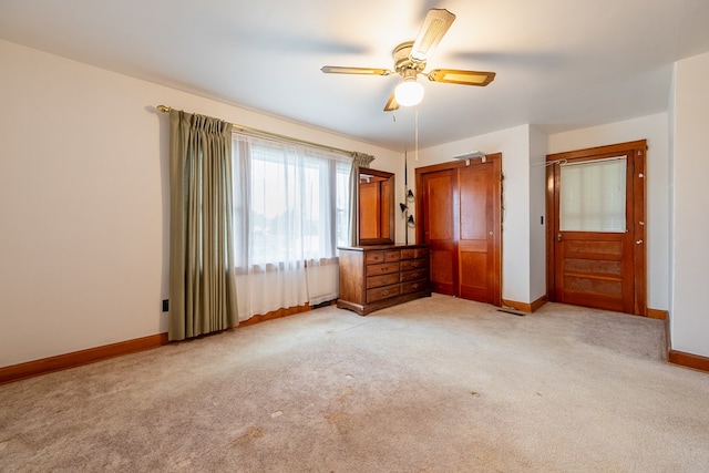 480 N 3rd St, Wytheville, VA 24382 - unfurnished bedroom featuring light colored carpet, baseboards, and a ceiling fan