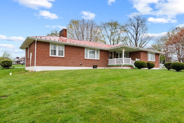 480 N 3rd St, Wytheville, VA 24382 - back of property featuring brick siding, a chimney, a lawn, and a porch