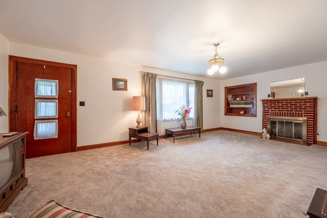 480 N 3rd St, Wytheville, VA 24382 - living area with baseboards, light carpet, a fireplace, and a chandelier