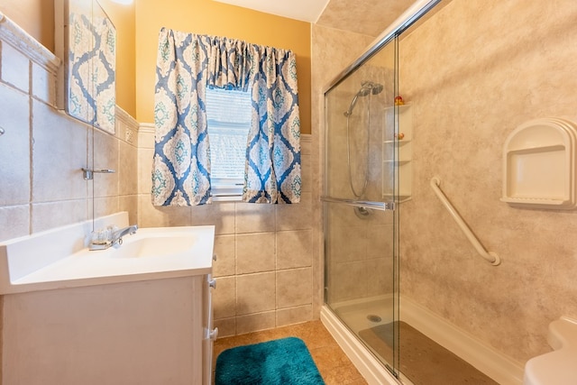 480 N 3rd St, Wytheville, VA 24382 - bathroom featuring tile walls, a stall shower, tile patterned flooring, vanity, and wainscoting