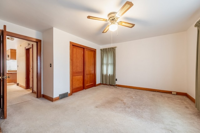 480 N 3rd St, Wytheville, VA 24382 - unfurnished bedroom with light colored carpet, a closet, baseboards, and a ceiling fan