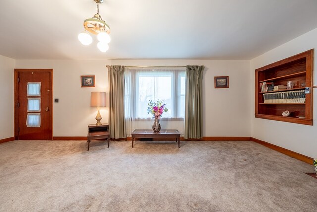 480 N 3rd St, Wytheville, VA 24382 - living area with a chandelier, carpet, and baseboards