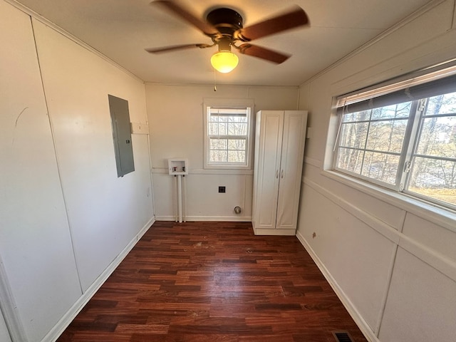 laundry room with laundry area, electric panel, dark wood finished floors, hookup for a washing machine, and crown molding