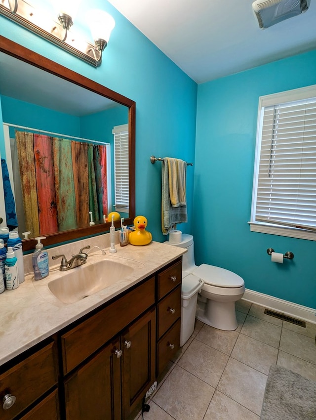 285 Dye Dr, Pilot, VA 24138 - bathroom with tile patterned flooring, toilet, vanity, baseboards, and curtained shower