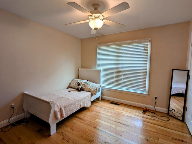 285 Dye Dr, Pilot, VA 24138 - bedroom with baseboards, light wood-type flooring, and ceiling fan
