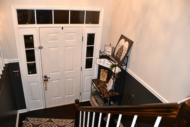 foyer entrance with dark wood finished floors
