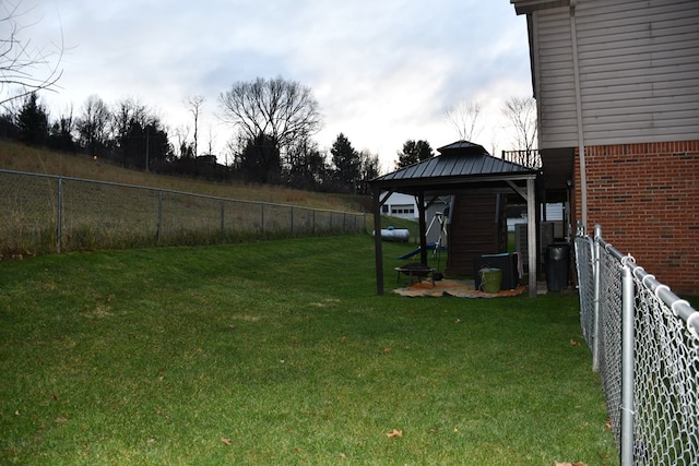 view of yard with a fenced backyard and a gazebo