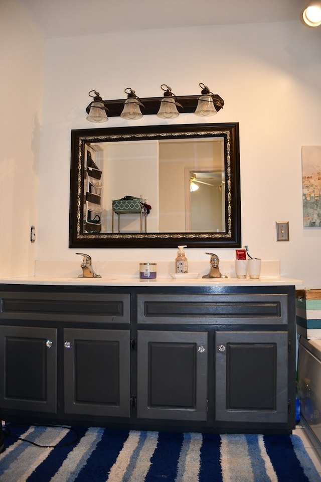 full bath featuring double vanity and a sink