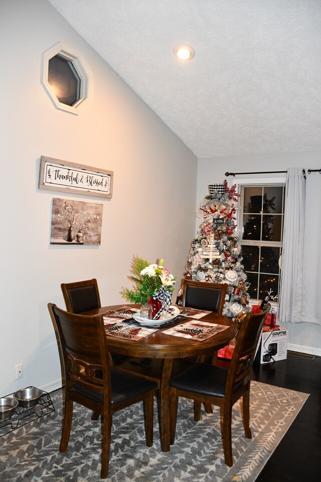dining room with recessed lighting, baseboards, and dark wood-style flooring