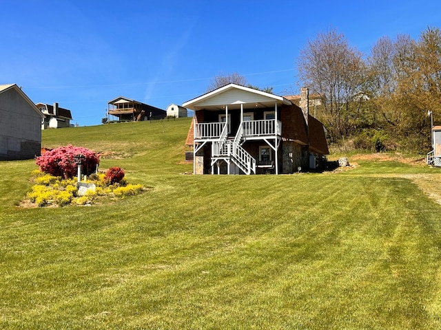 542 Volunteer Rd, Fancy Gap, VA 24328 - rear view of house featuring a lawn, stairs, a porch, and a chimney
