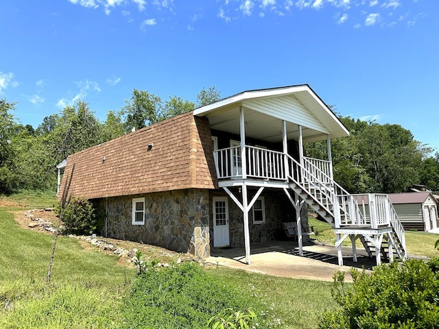 542 Volunteer Rd, Fancy Gap, VA 24328 - back of house with roof with shingles, a lawn, a patio, stone siding, and stairway